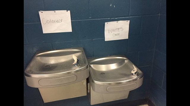 Photo from http://www.wftv.com/news/local/investigation-underway-after-2-racist-signs-posted-above-water-fountains-at-first-coast-high-school/466146633
